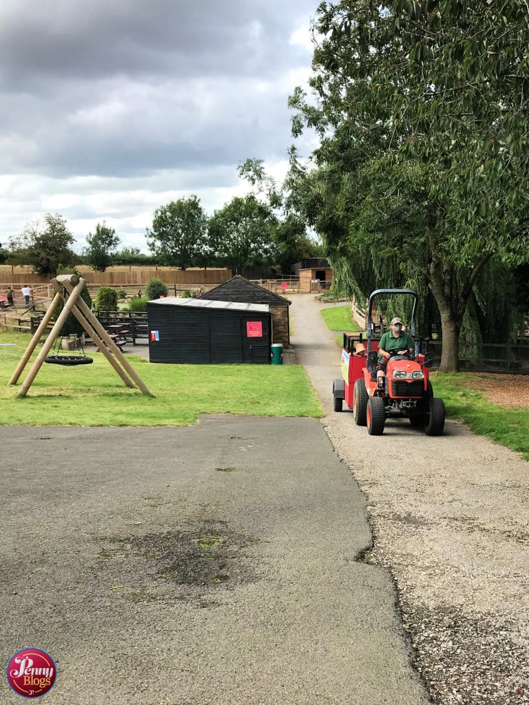 A tractor driving round Woodside Animal Farm