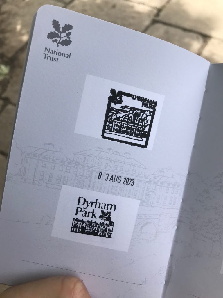 A page inside a National Trust passport showing two different Dyrham Park stamps and a date stamp.