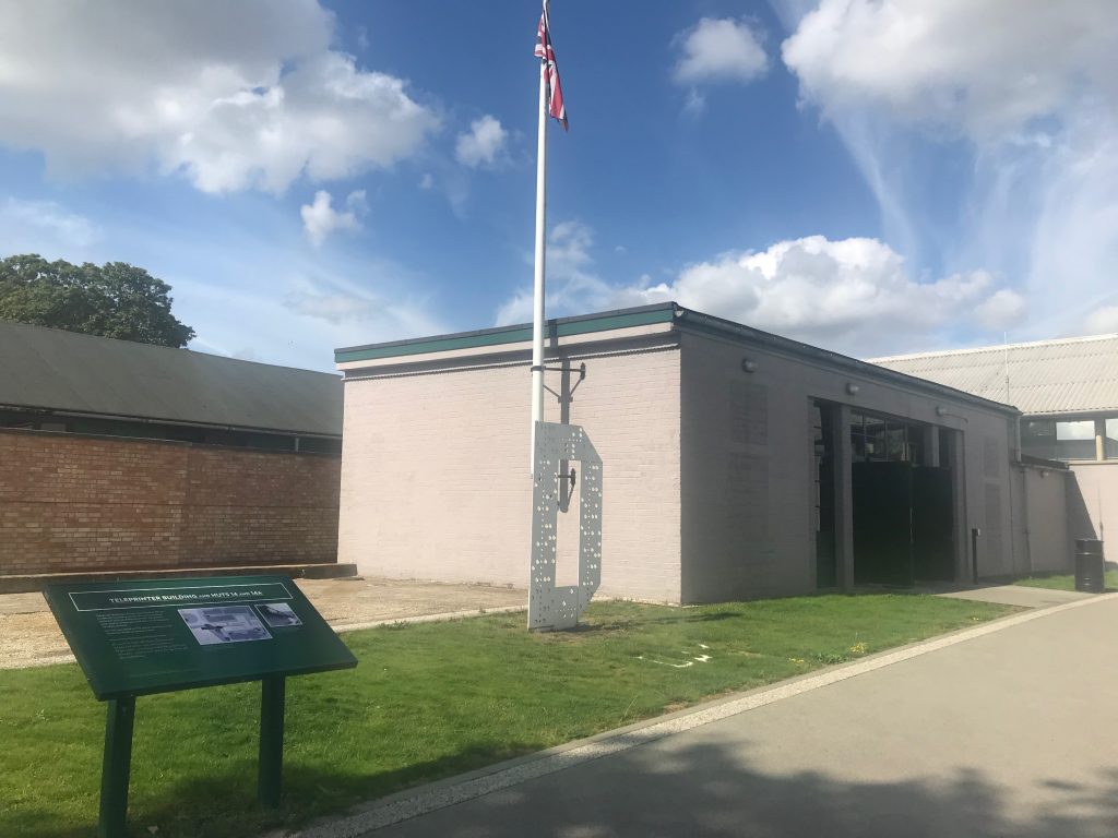 The outside of a low squat building which contains an exhibition about the park's role in D Day.