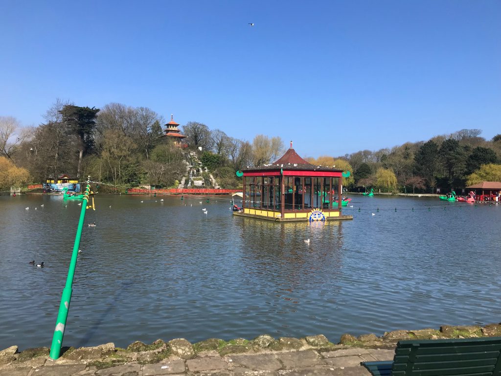 A view across the lake at Peasholm Park, Scarborough. In the distance you can see the Pagoda on the island in the middle of the lake. On the water are a variety of ducks and dragon pedalos.