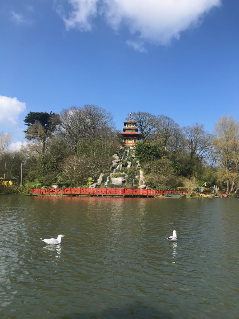 A view of the pagoda on the island in the middle of the lake at Peasholm Park. In front of it is a water cascade into the lake.