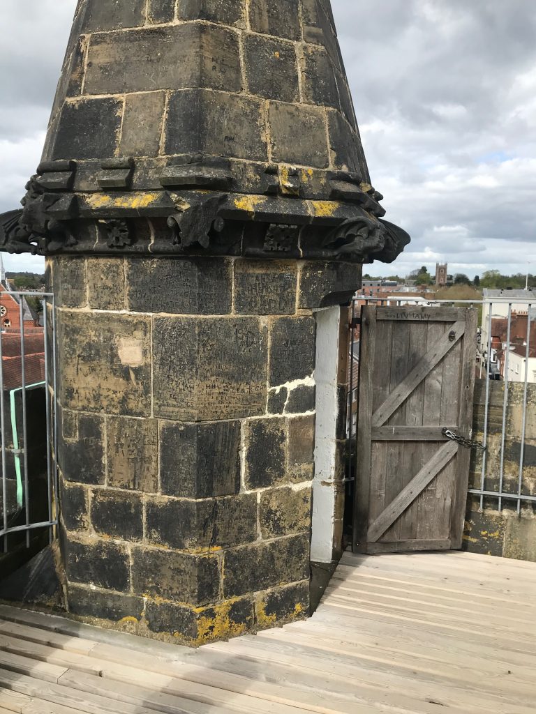 A view of a small stone turret on teh top of teh clock tower which is where you emerge from the stairs onto the roof.